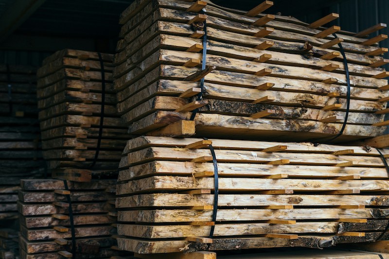 image of a large stack of UC4 timber beams