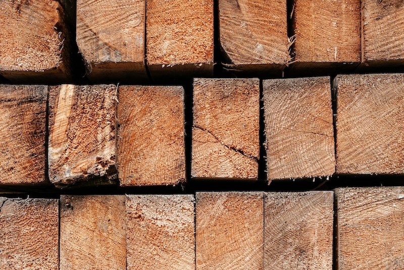 image of a stack of pinewood beams