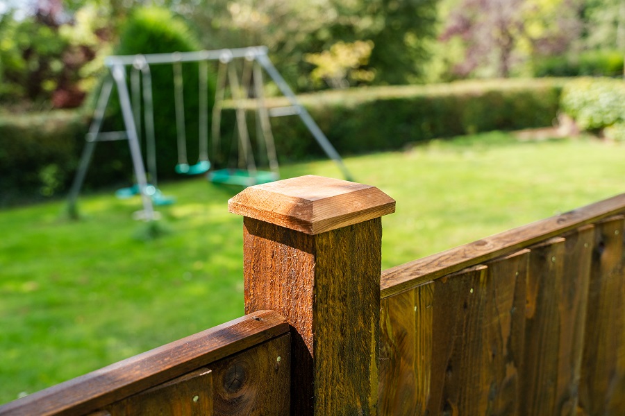 Brown 4 Inch Post Cap on a fence post